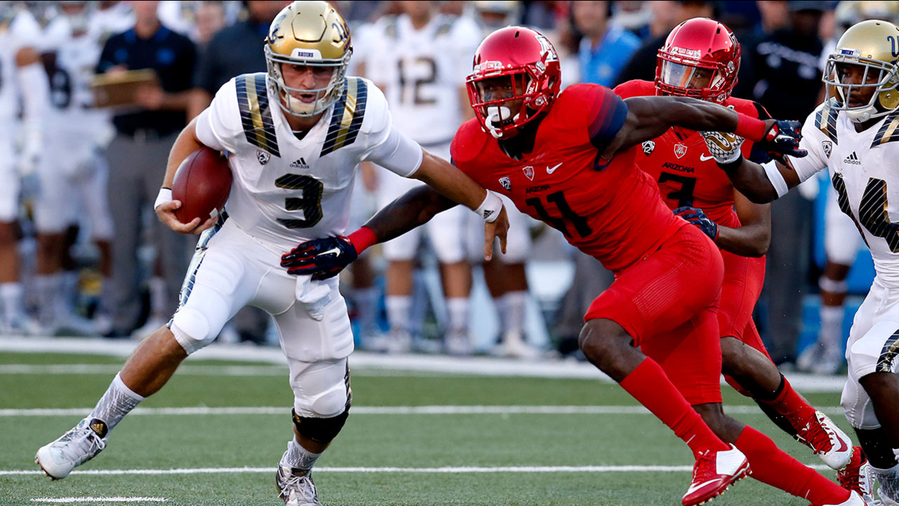UCLA quarterback Josh Rosen (3) gets away from Arizona safety Will Parks during the first half of an NCAA college football game, Saturday, Sept. 26, 2015, in Tucson, Ariz.