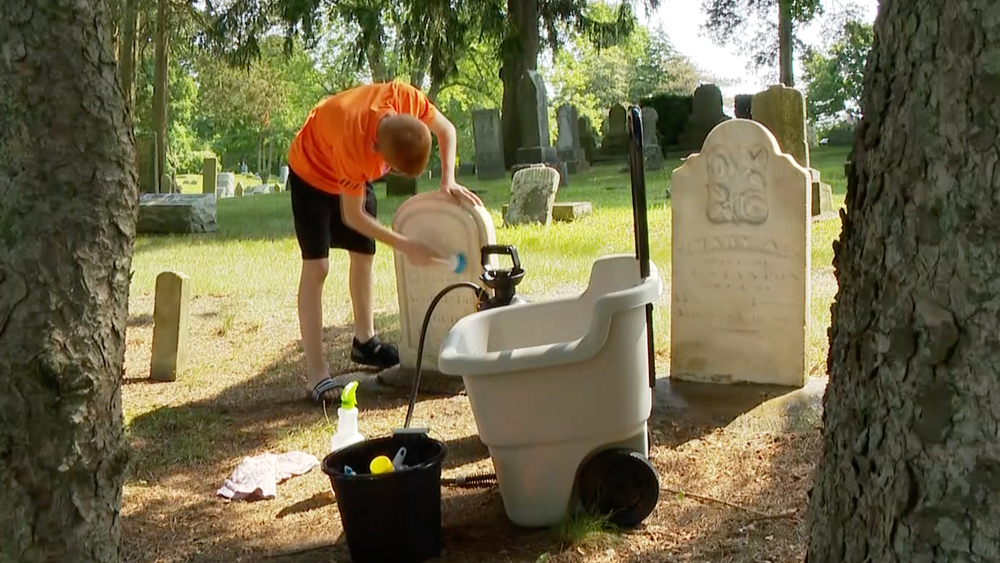 Kid starts small business cleaning headstones