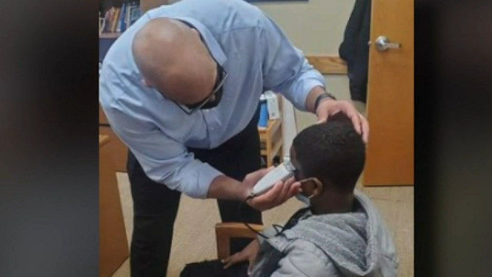 Principal fixes insecure middle school student's haircut to get him back to class