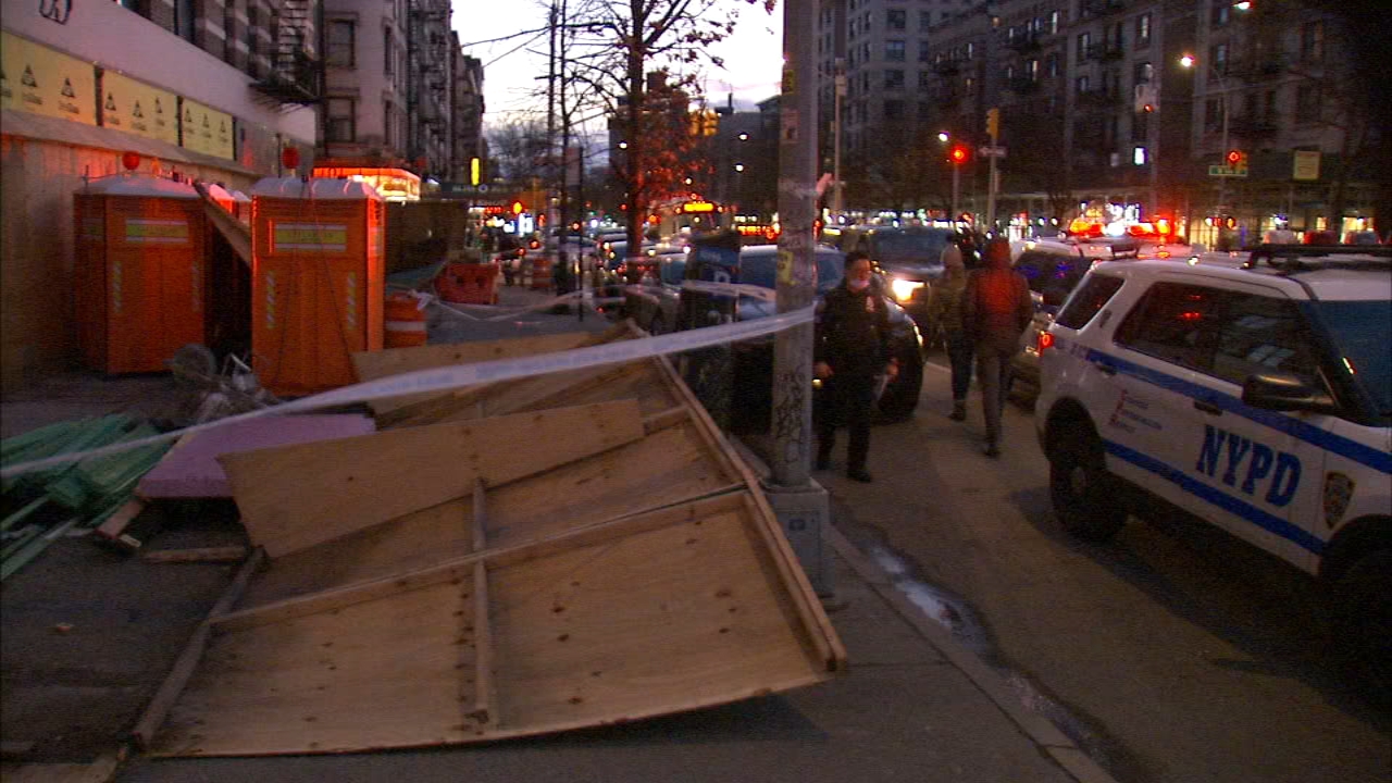 Woman struck in head by fallen construction fence