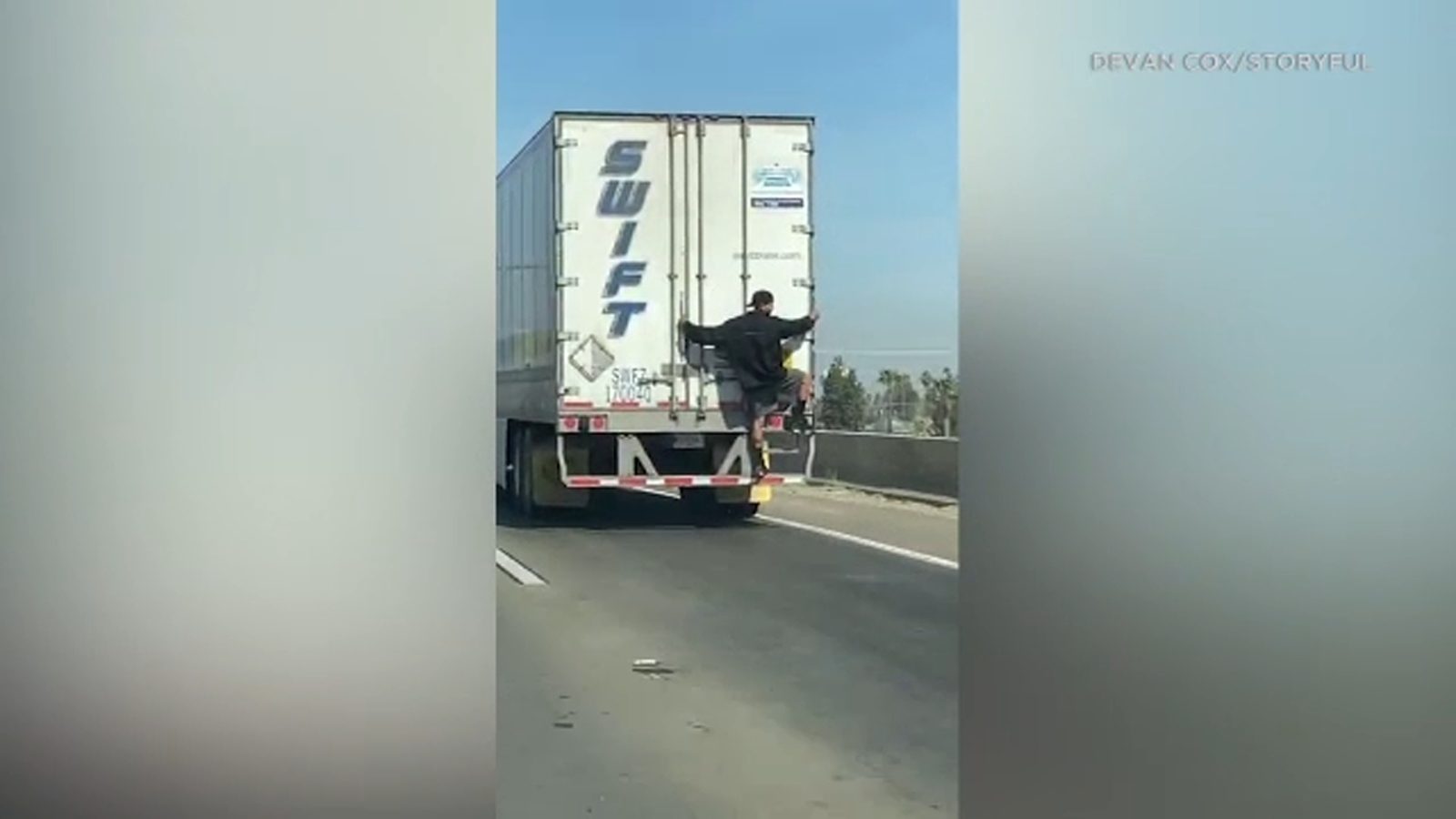 Man spotted on the back of moving semitruck on 5 Freeway in