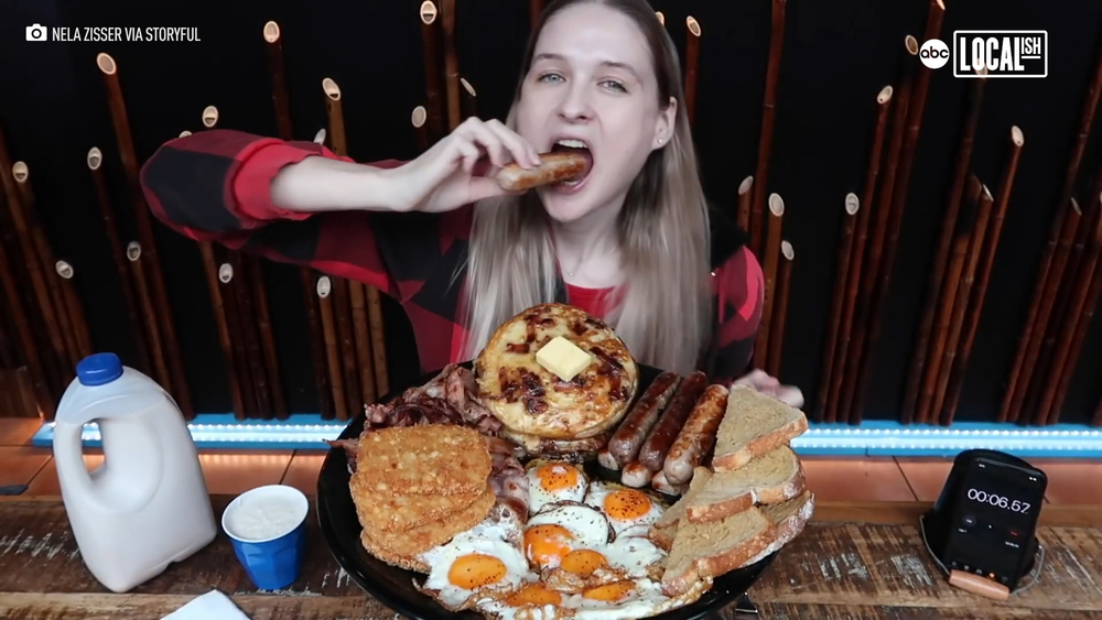 Woman takes on American breakfast challenge. 