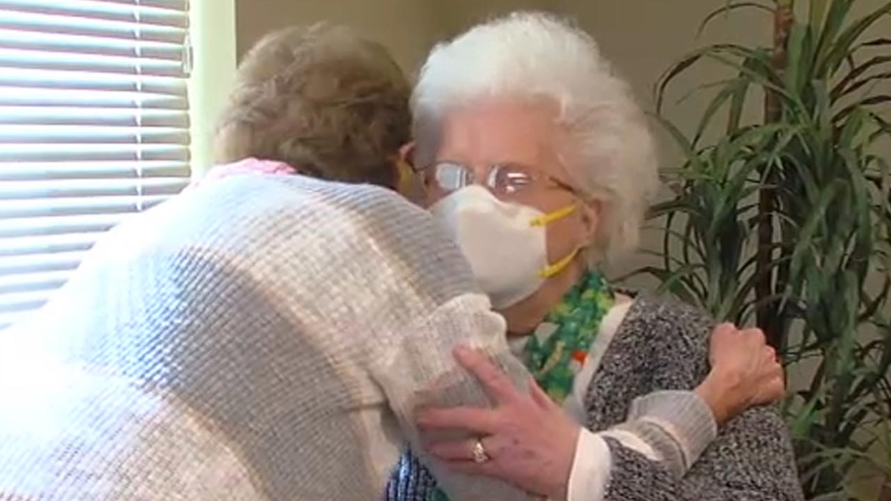Twins hug for first time after more than year of social distancing
