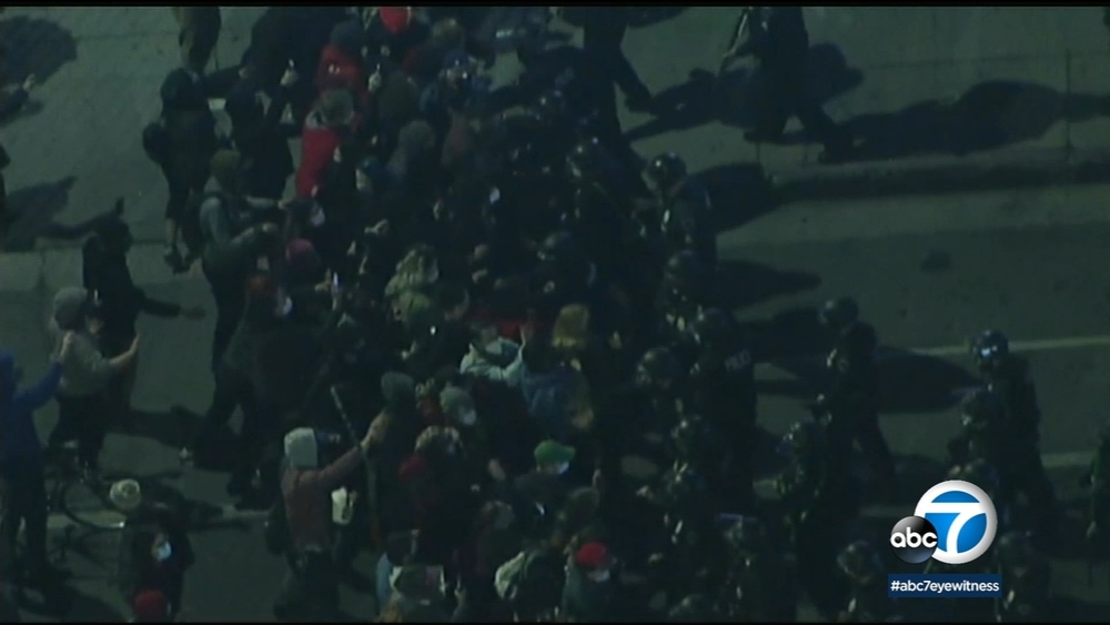 Protesters, LAPD face off again over Echo Park Lake homeless camps 