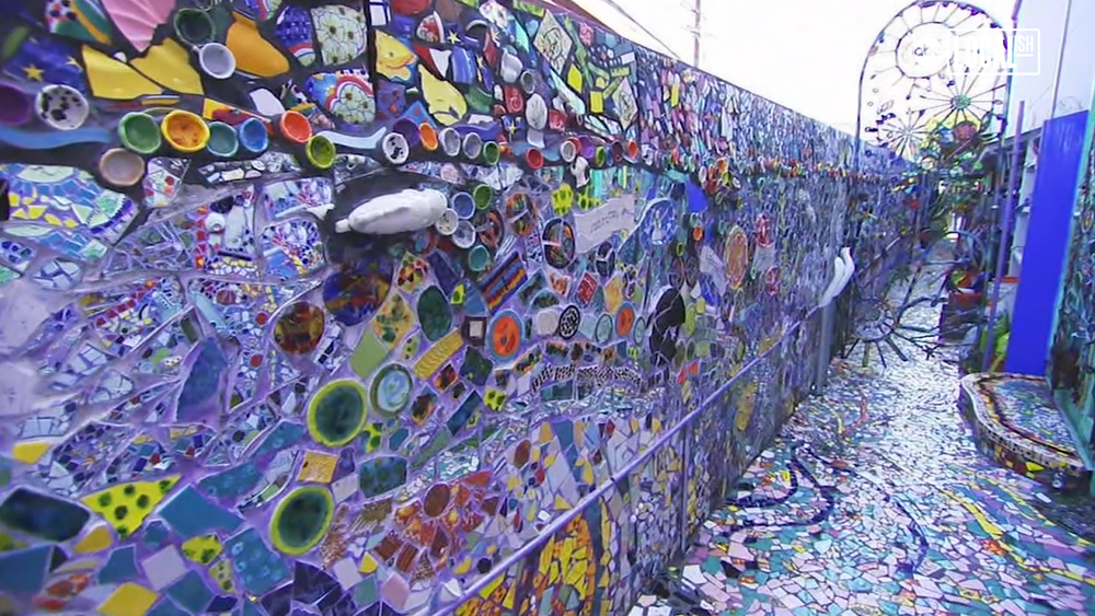 Step into the colorful world of the Mosaic Tile House