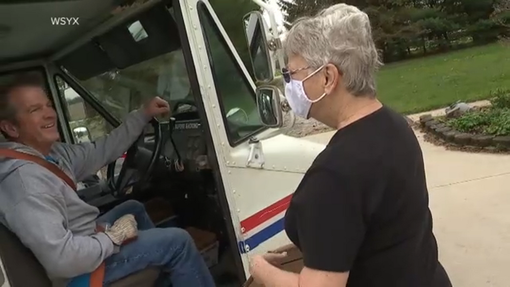 Neighbors surprise beloved mailman with special sendoff along his route