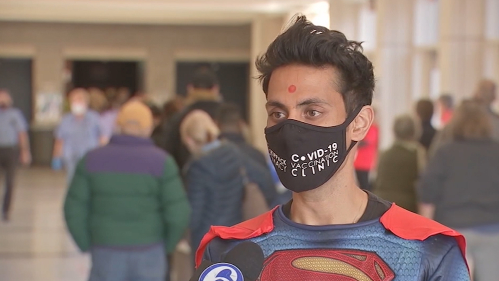 'Superman' pharmacist races to vaccinate community