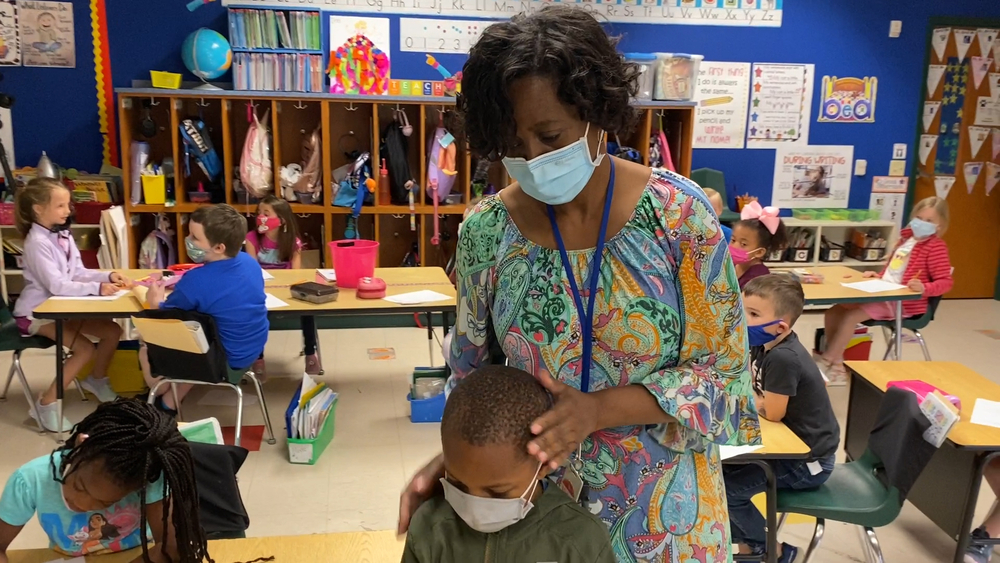 Beloved teacher's journey from cleaning classrooms to leading them