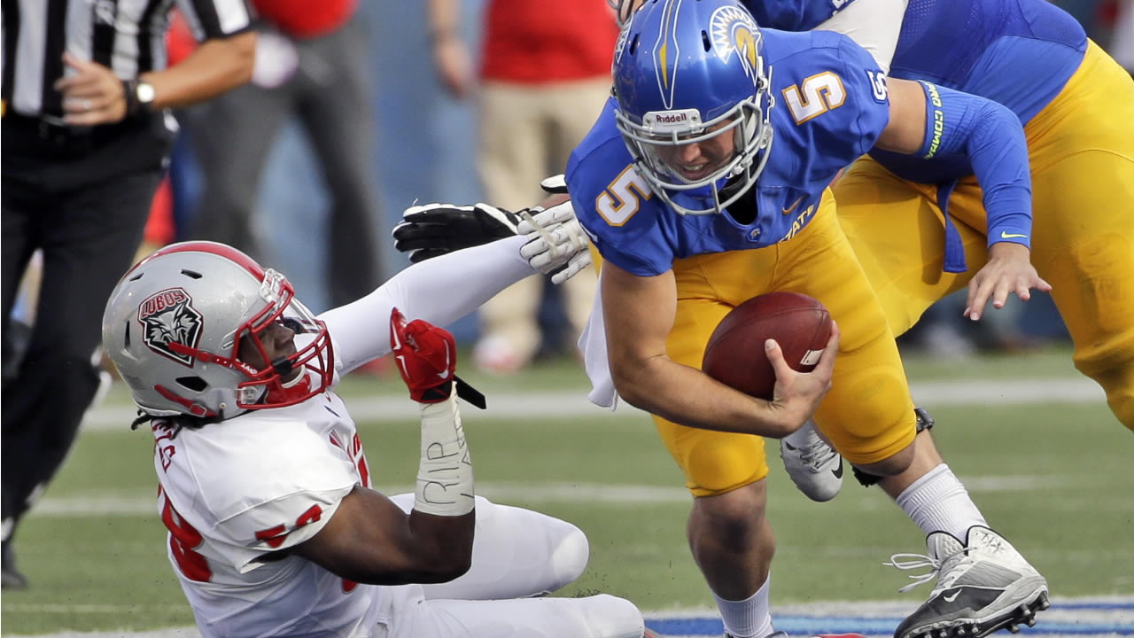 New Mexico linebacker Maurice Daniels, left, sacks San Jose State quarterback Kenny Potter during the first half of an NCAA college football game Saturday, Oct. 24, 2015, in San Jose, Calif.