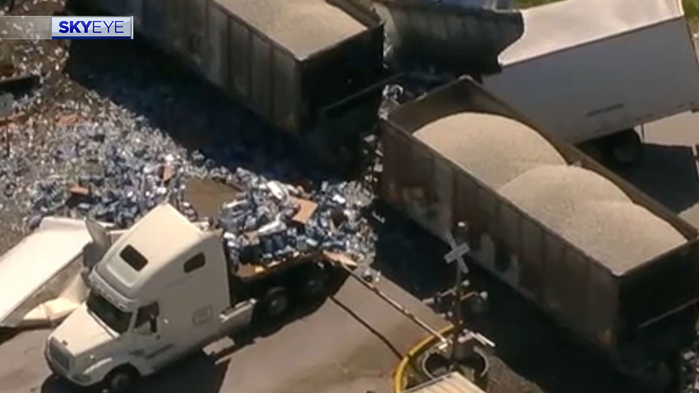 Train splits in half 18-wheeler carrying bottled water