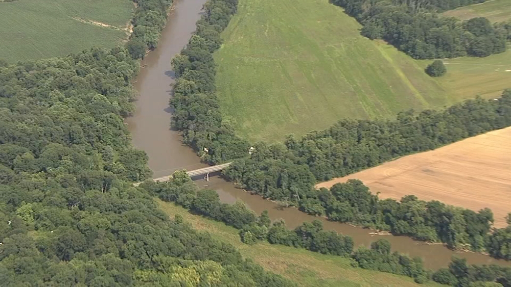 7-year-old boy, woman still missing day after tubers went over dam