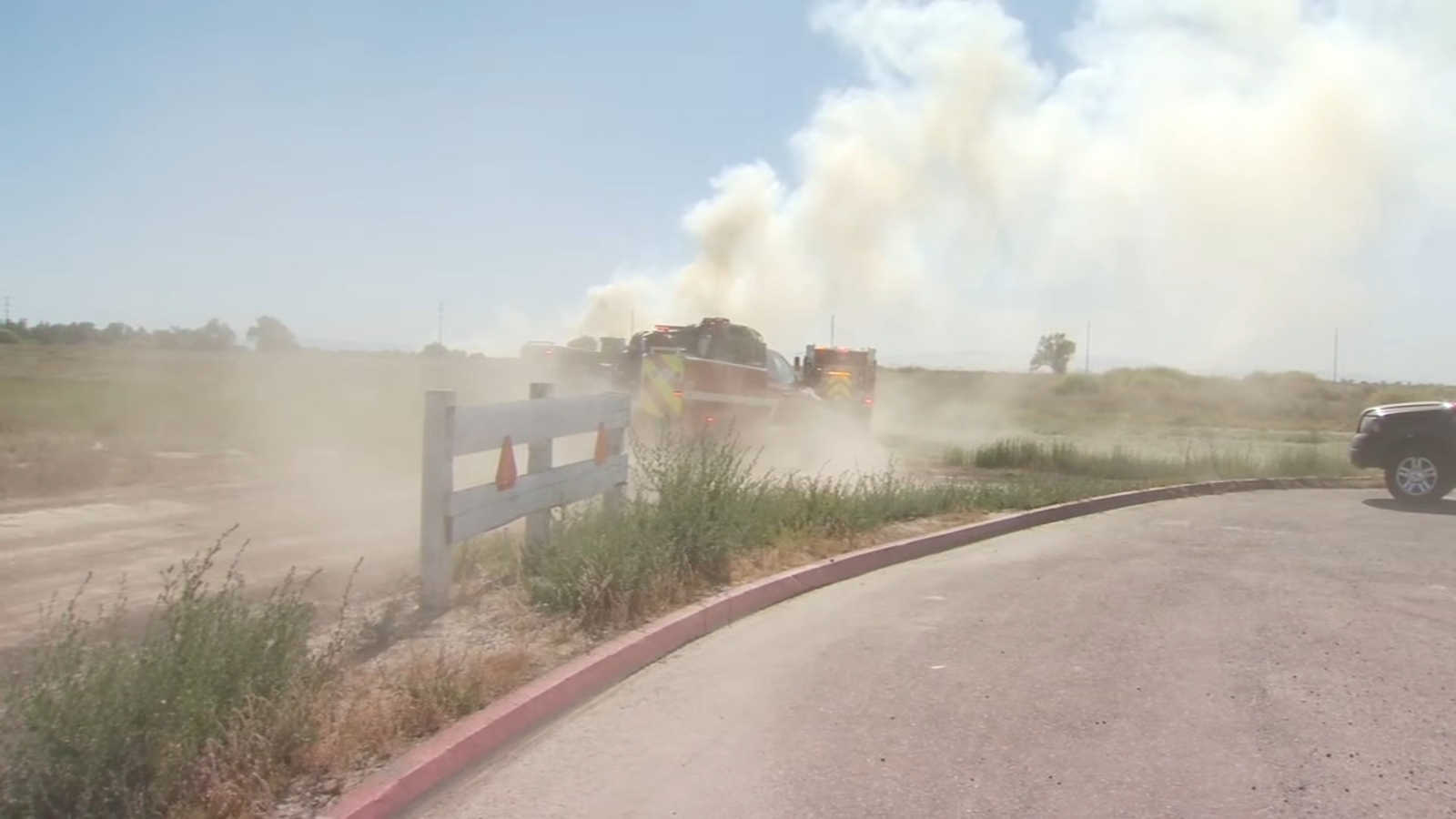 Fire crews battling grass fire near site of Lemoore water tank rupture