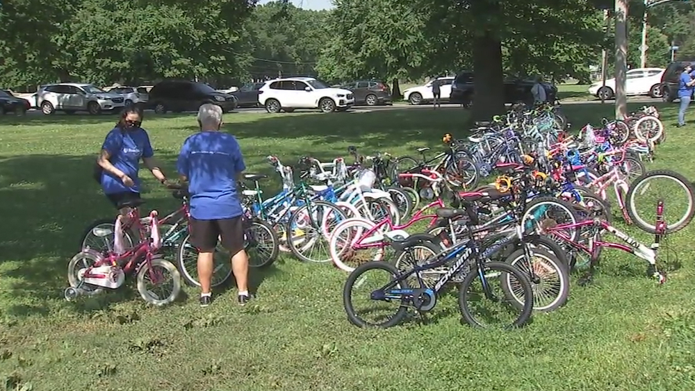 Healthcare worker, police officer gift bikes to neighborhood kids