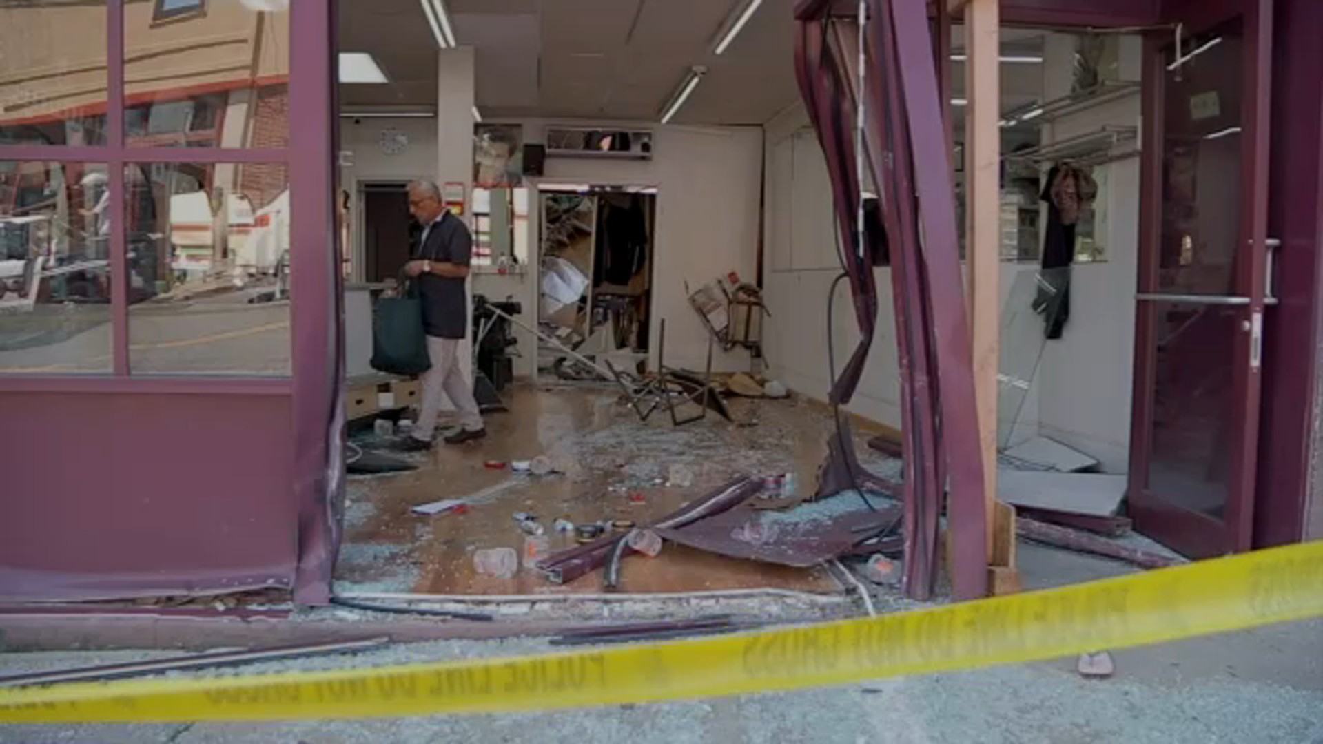 Mother and child being treated for significant injuries in barbershop crash