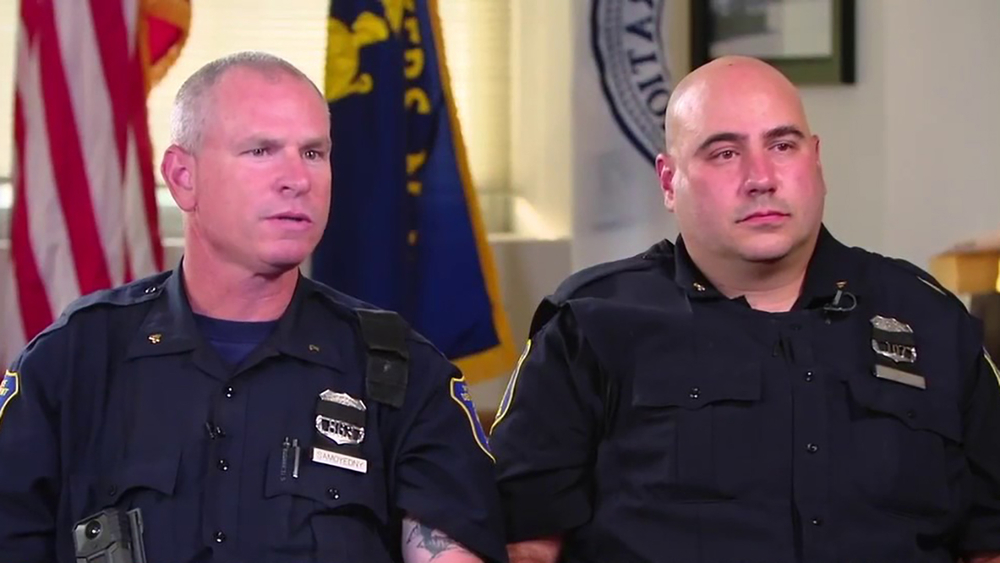 Hero officers, bystanders rescue mom, baby pinned under car