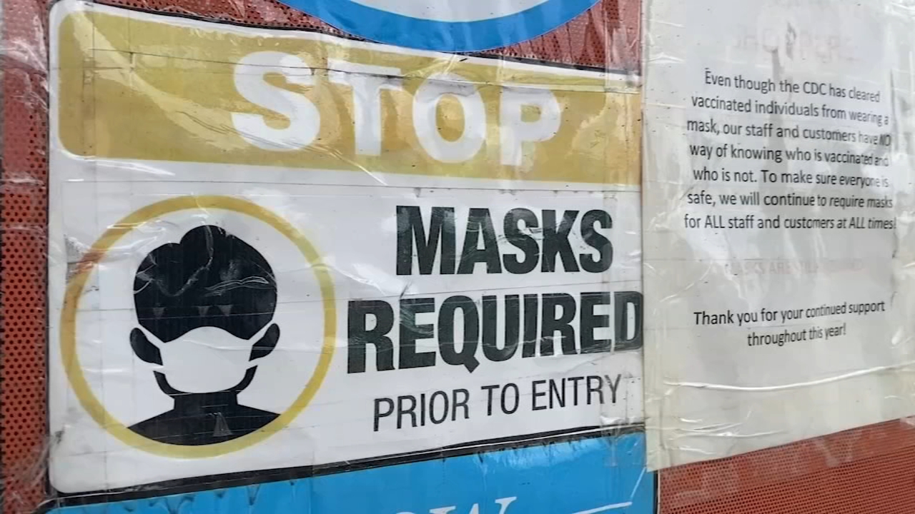 Some businesses reinstate mask mandate as COVID cases surge