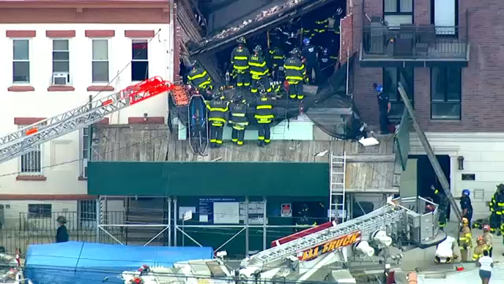 Firefighters respond to scene of construction site collapse