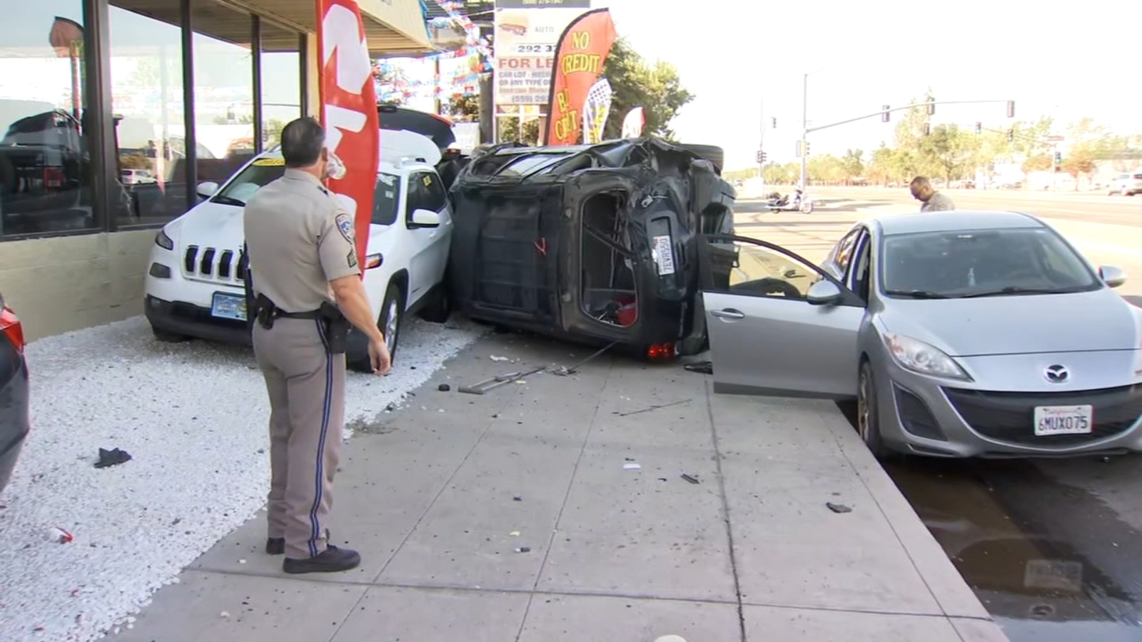 One killed after car crashes into auto dealership in Fresno County ...