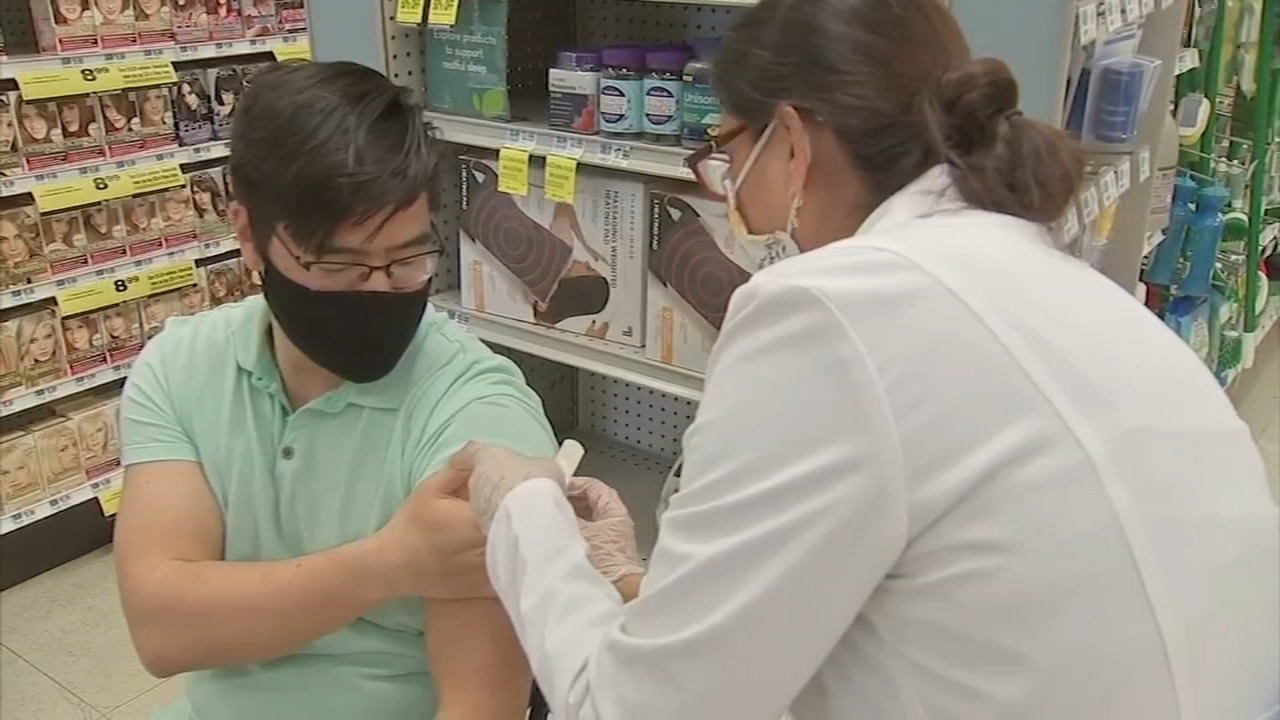As officials ponder booster shots, businesses switch gears on masks