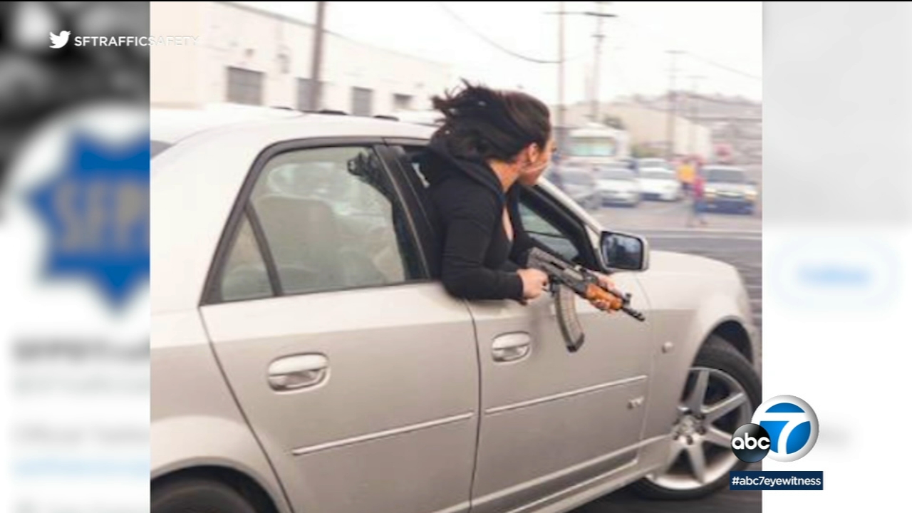 Woman leans out of car window holding AK-47 in SF