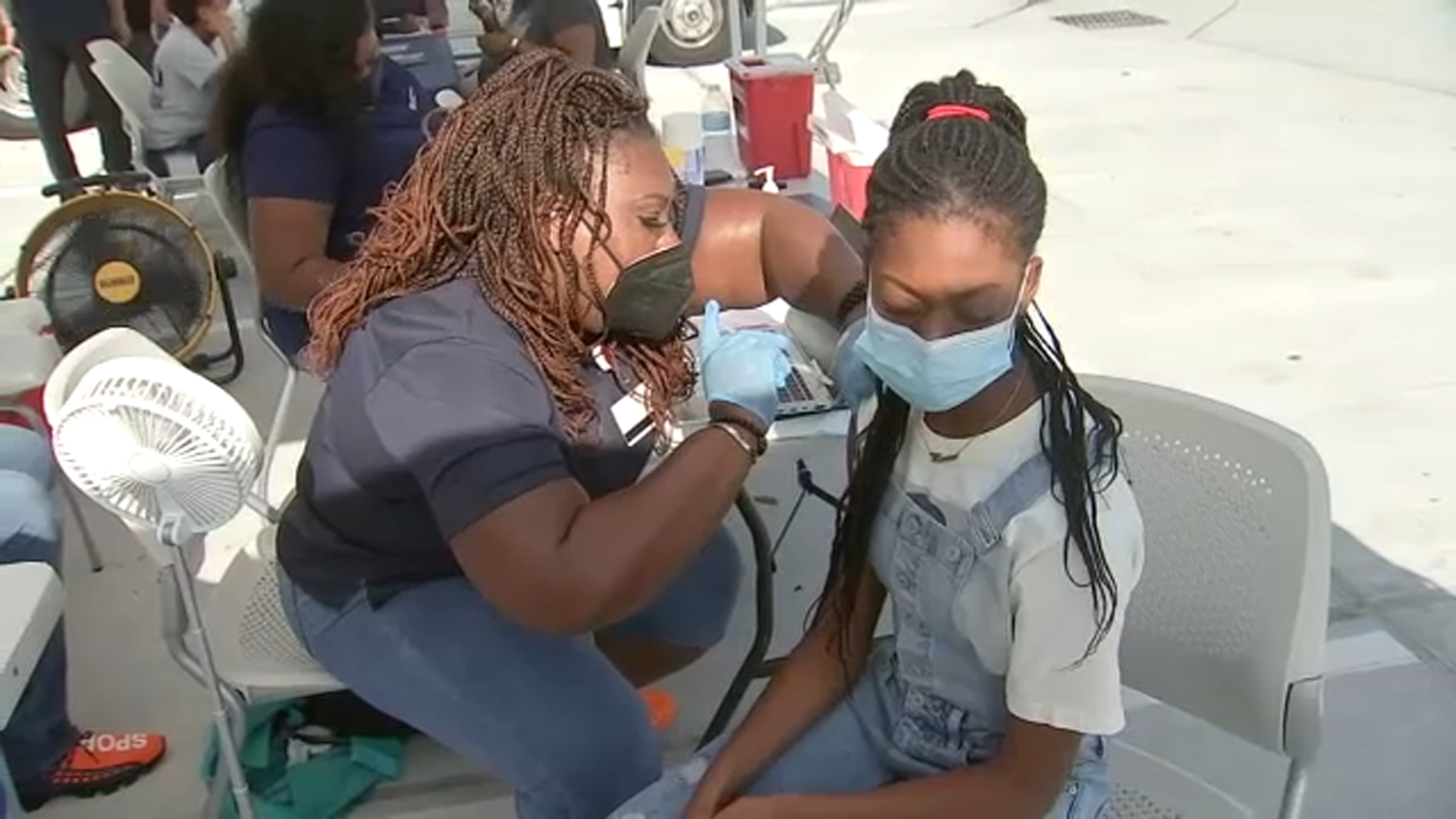 Students roll up sleeves for 'super' COVID vaccination event
