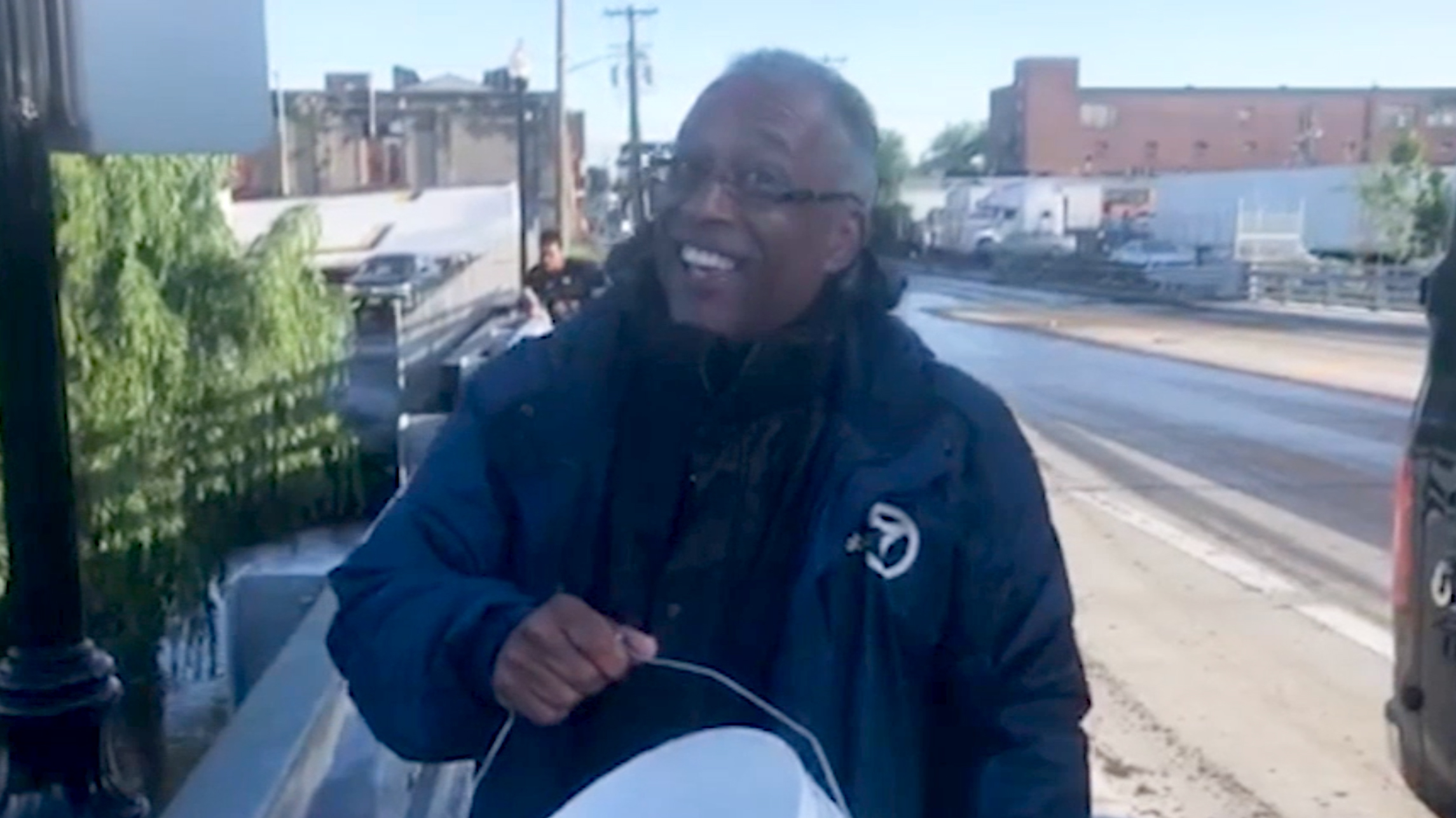Reporter Anthony Johnson rescues stranded fish in Passaic