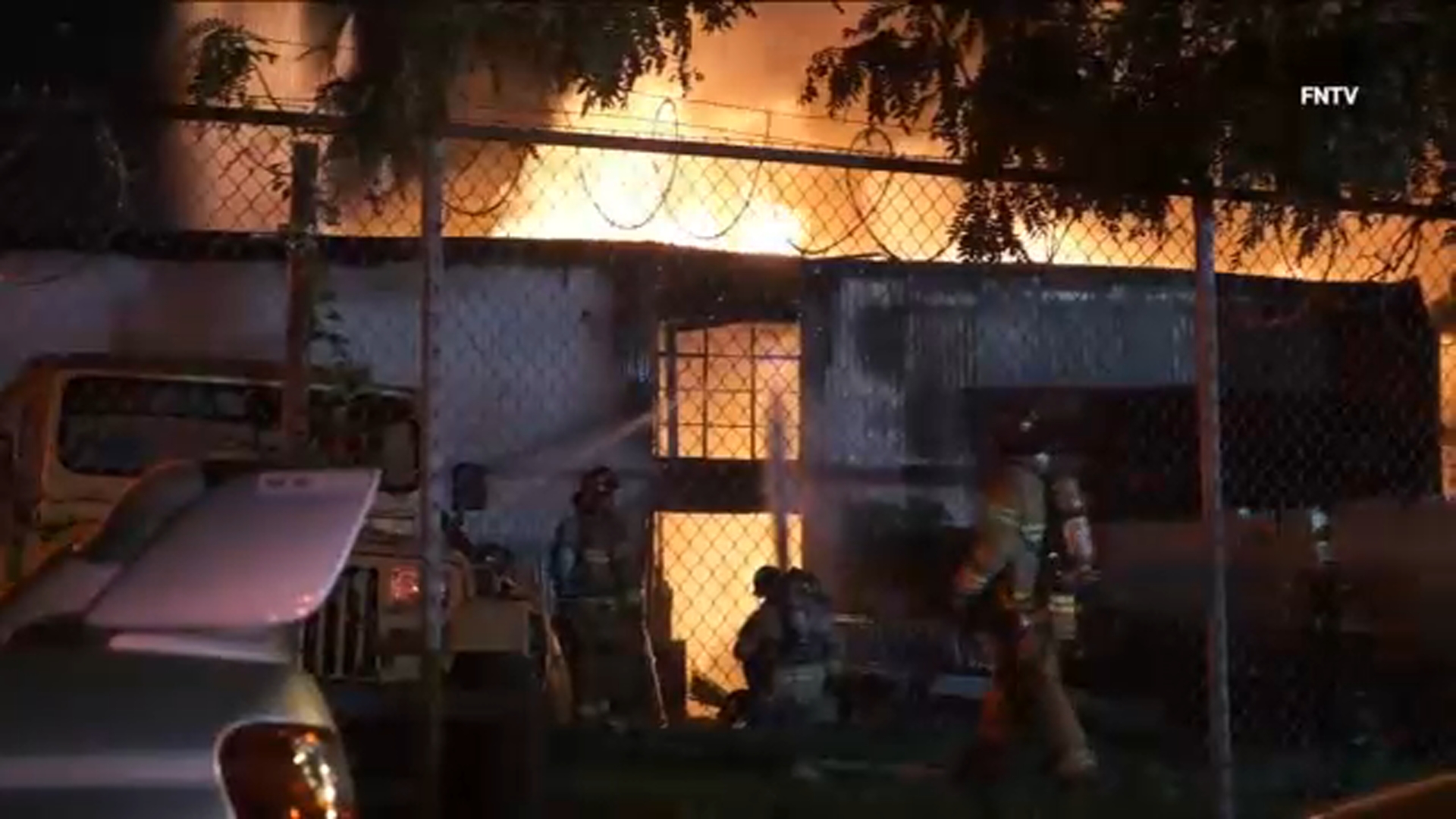 Heavy flames tear through row of auto body shops in Jersey City
