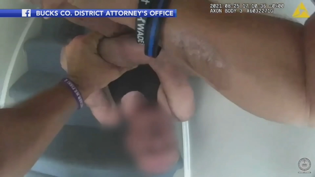 Body cam video shows police officers save man from fire