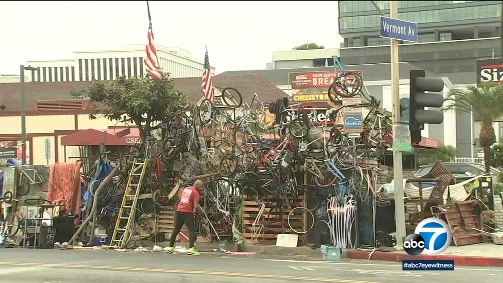 Homeless artist builds wall of bikes at Koreatown encampment