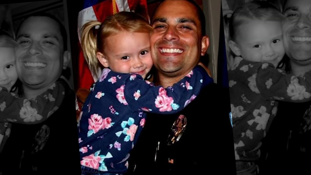Arizona officer adopts girl he consoled during welfare check