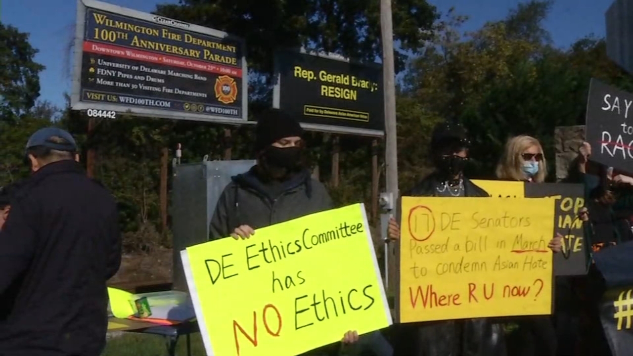 Group protests in front of billboard calling for resignation