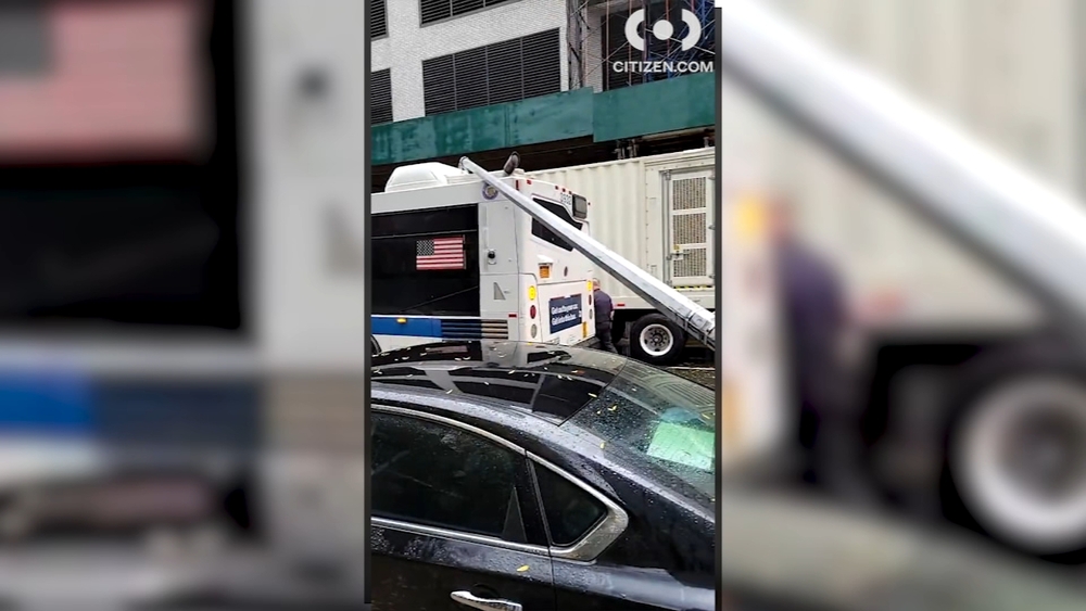 Gusty winds bring down light pole on NYC bus