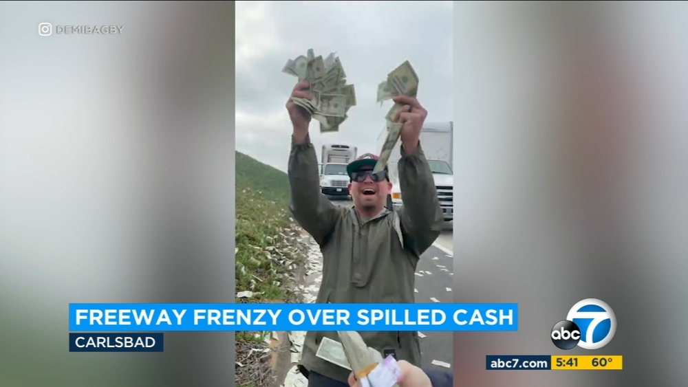 Drivers scramble as cash falls from armored truck on freeway