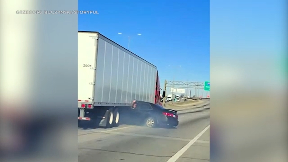 Shocking video shows big rig dragging car along busy Illinois highway