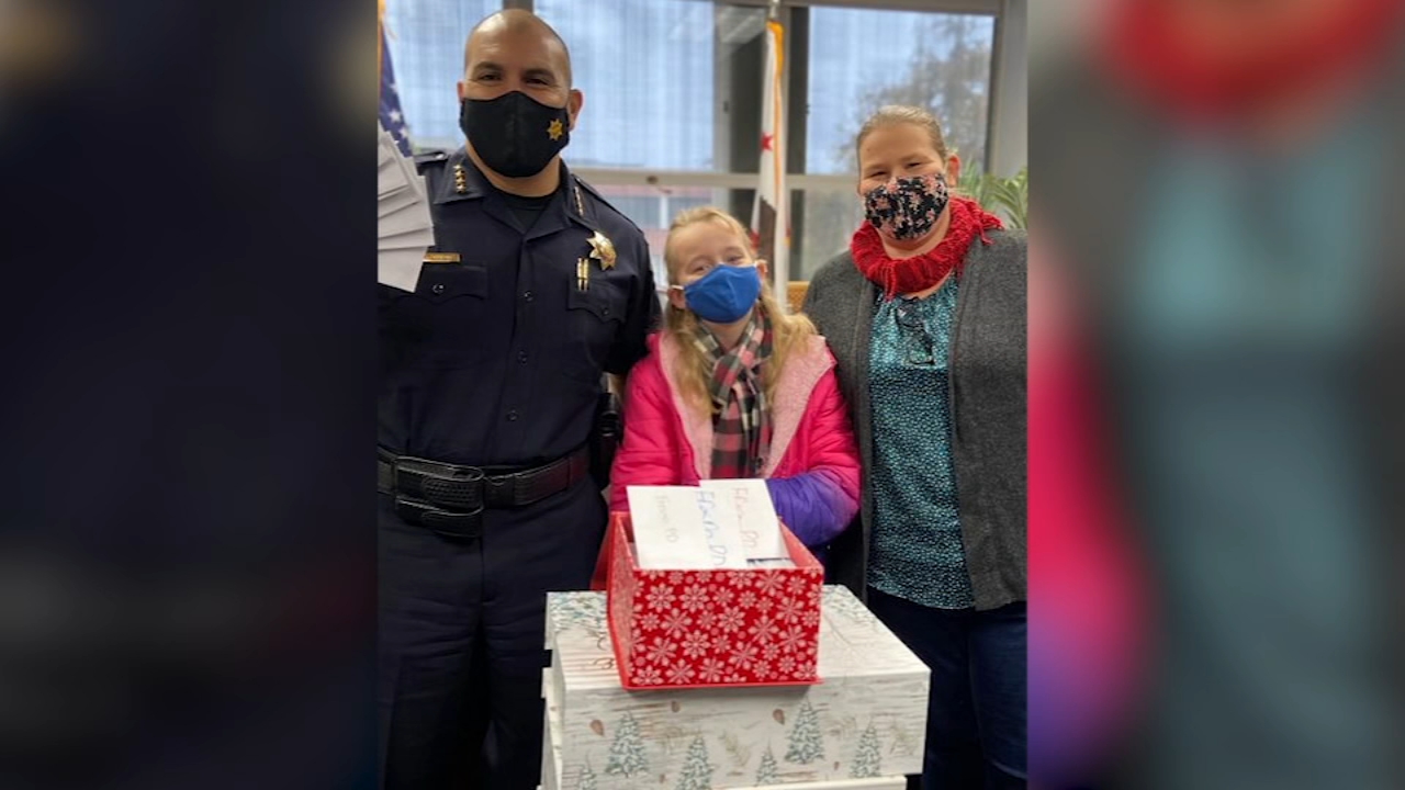 6-year-old girl gives Christmas cards to Fresno Police Department