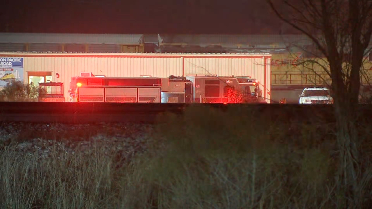 Hazmat crews cleaning up after 18-wheeler rollover at railyard