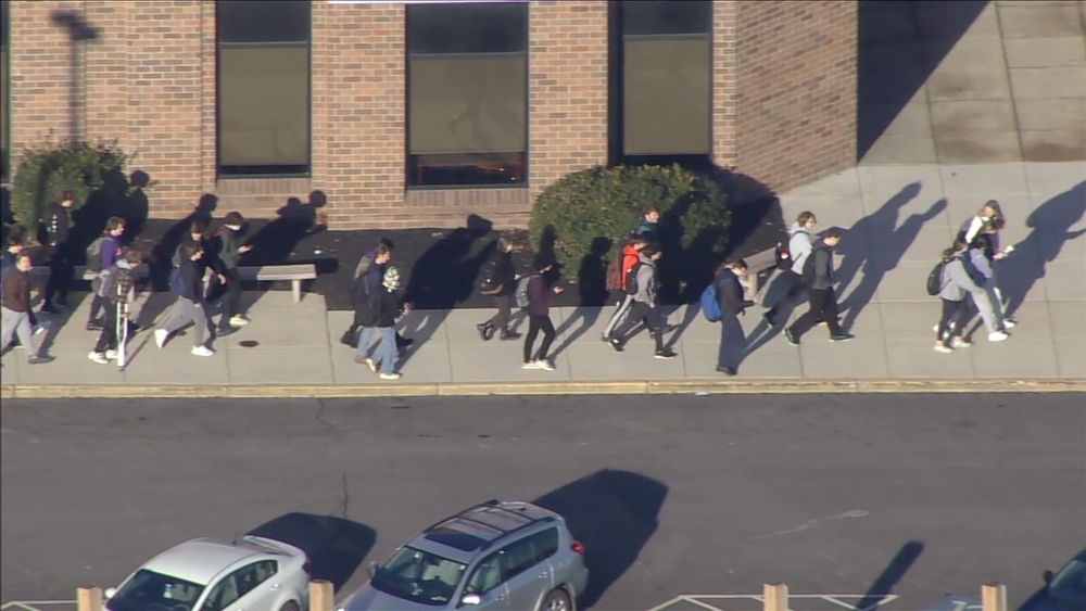 School students stage walkout over reinstated mask mandate