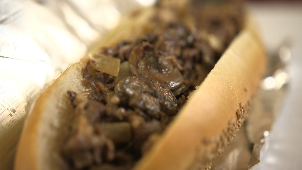 Man eats 1000 different cheesesteaks!