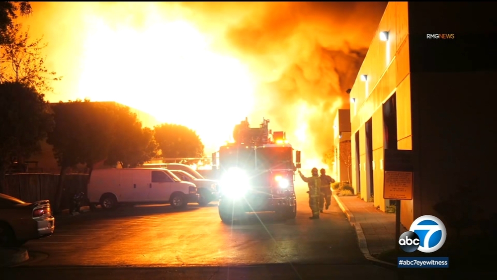 Massive fire rips through foam business in Orange County