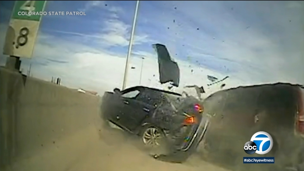 Video shows minivan smash into parked car, narrowly hit trooper
