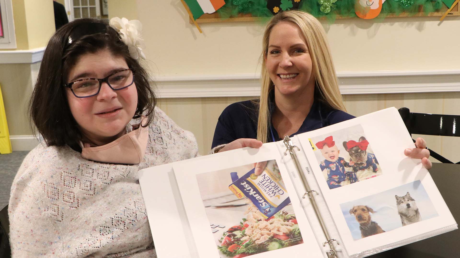 Student with special needs crafts memory books for seniors