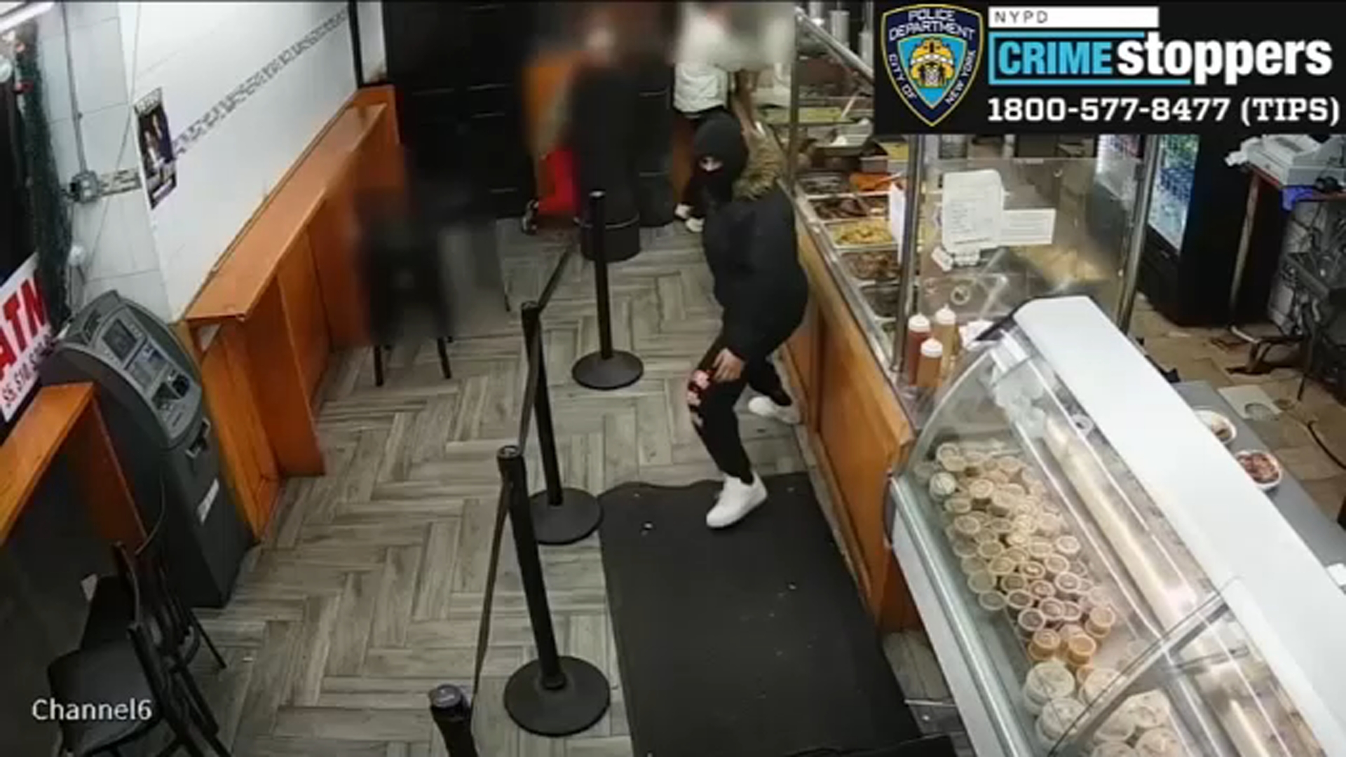 Search for armed suspects in robbery of fried chicken restaurant in Inwood