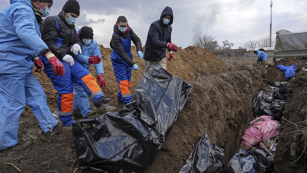 Mass grave dug; evacuations in Ukraine