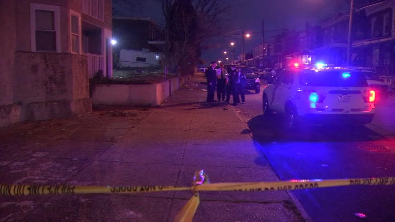 Man shot dead while holding baby in car seat; suspect wanted