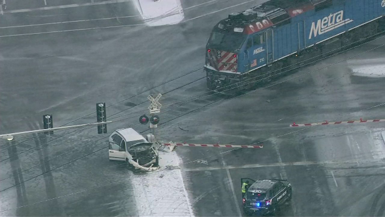 A woman suffered minor injuries after a Metra Southwest Service train struck the SUV she was driving near West 87th Street and South Pulaski Road in south suburban Hometown. 