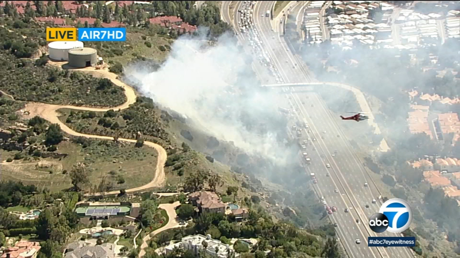 Firefighters battle brush fire along 118 Freeway in Chatsworth area as ...
