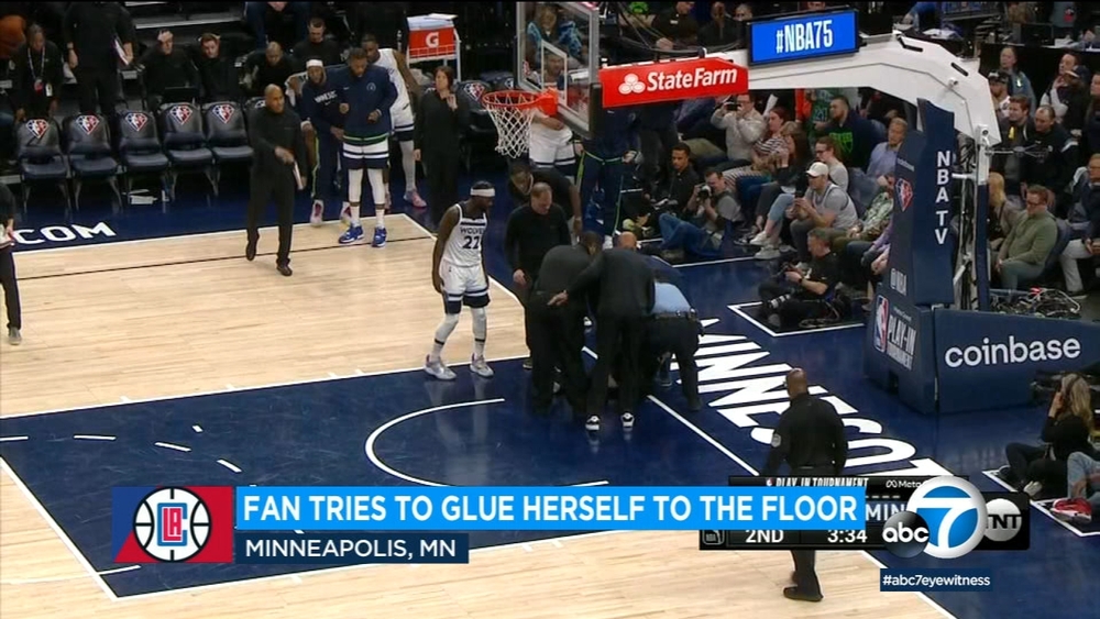 Fan delays Clippers play-in game; attempts to glue herself to floor