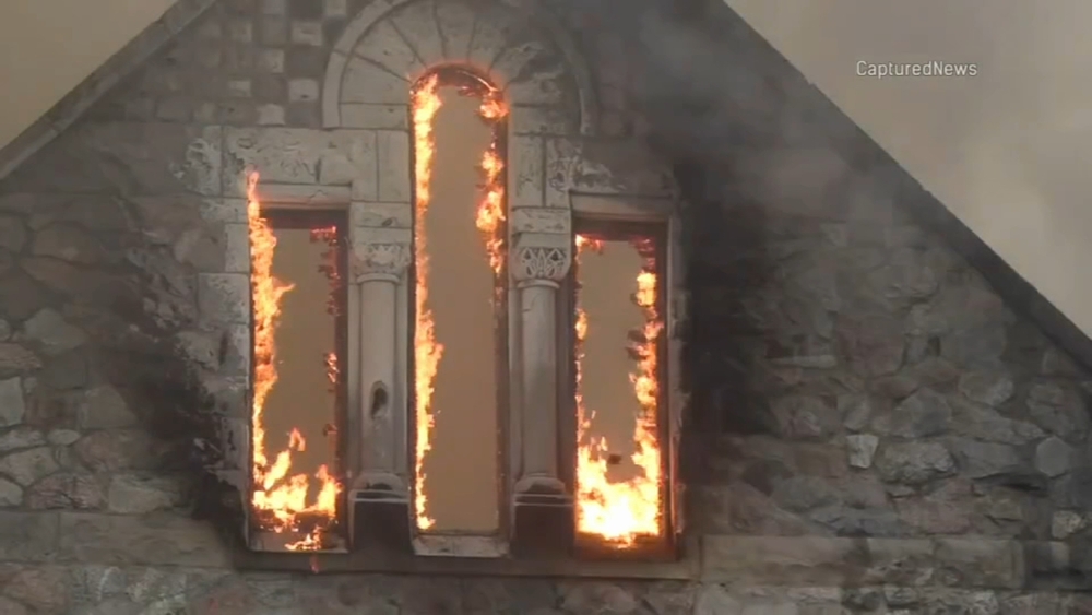 South Side church mural remain untouched by fire as flare-ups continue