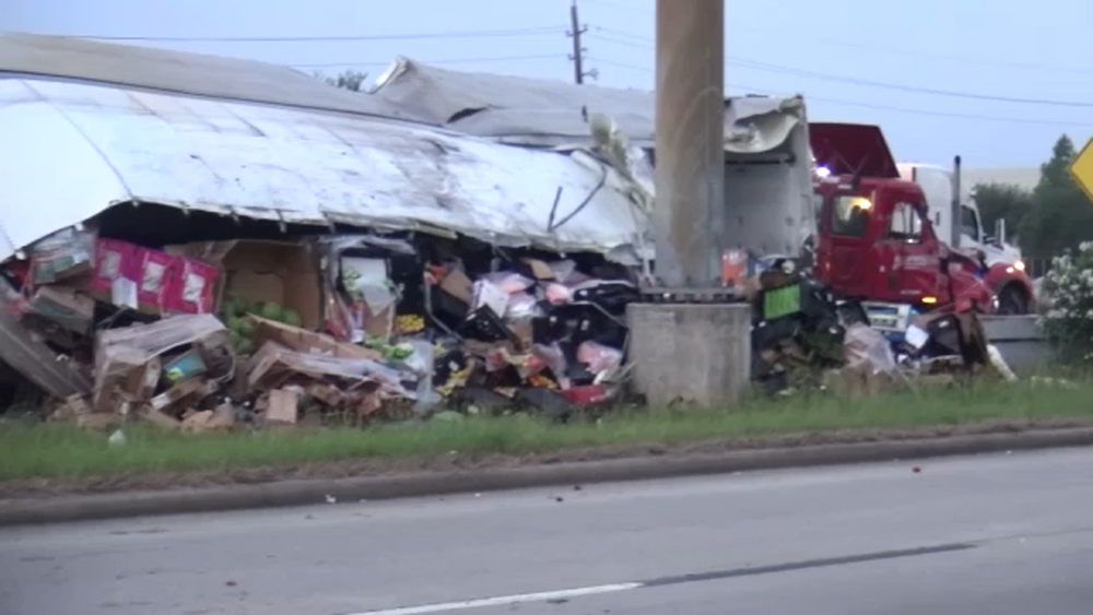 Driver rescued after 18-wheeler rolls over on Beltway 8