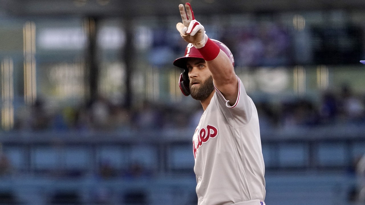 Bryce Harper of the Philadelphia Phillies looks on from the dugout